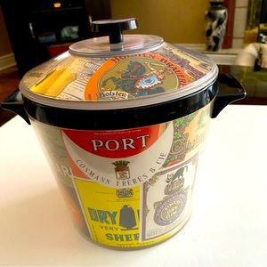 1950’s vintage ice bucket with liquor label collage. Preowned good condition